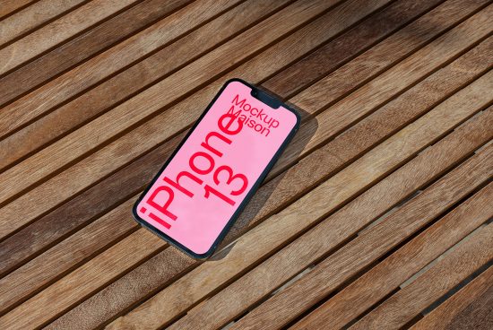 Smartphone mockup on wooden slats with pink screen for design presentations, device mockup, digital asset for designers, iPhone 13 graphic.