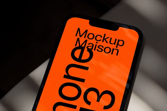 Smartphone screen mockup with vibrant orange design on tilted device showcasing modern graphic layout for creative digital asset marketing.