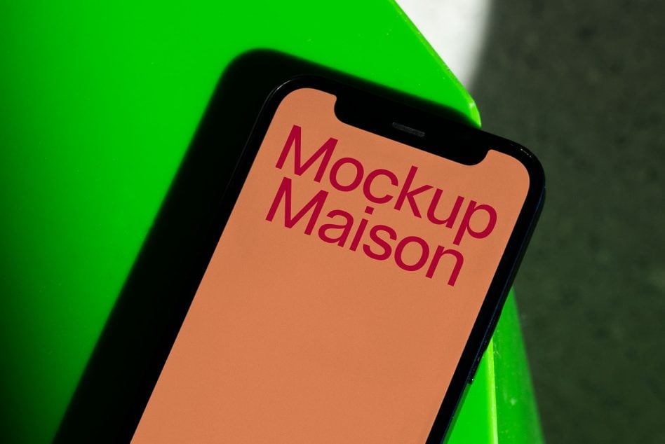 iPhone on neon green background with peach orange screen mockup