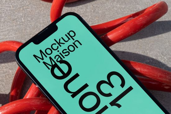 Smartphone mockup on red twisted surface showcasing screen with bold typography, ideal for designers looking to display UI/UX designs.