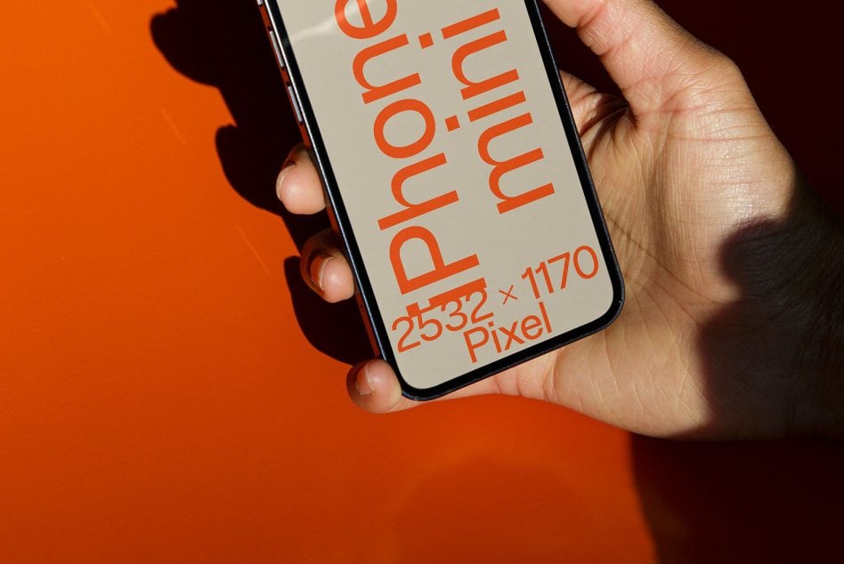 Close-up iPhone in hand against orange backdrop, vertical screen mockup