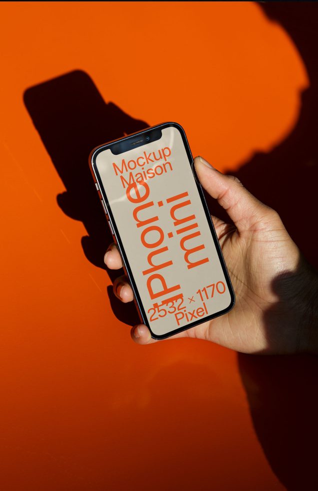 ALT: Hand holding smartphone with mockup screen on vibrant orange background, ideal for design presentations and digital mockup assets.