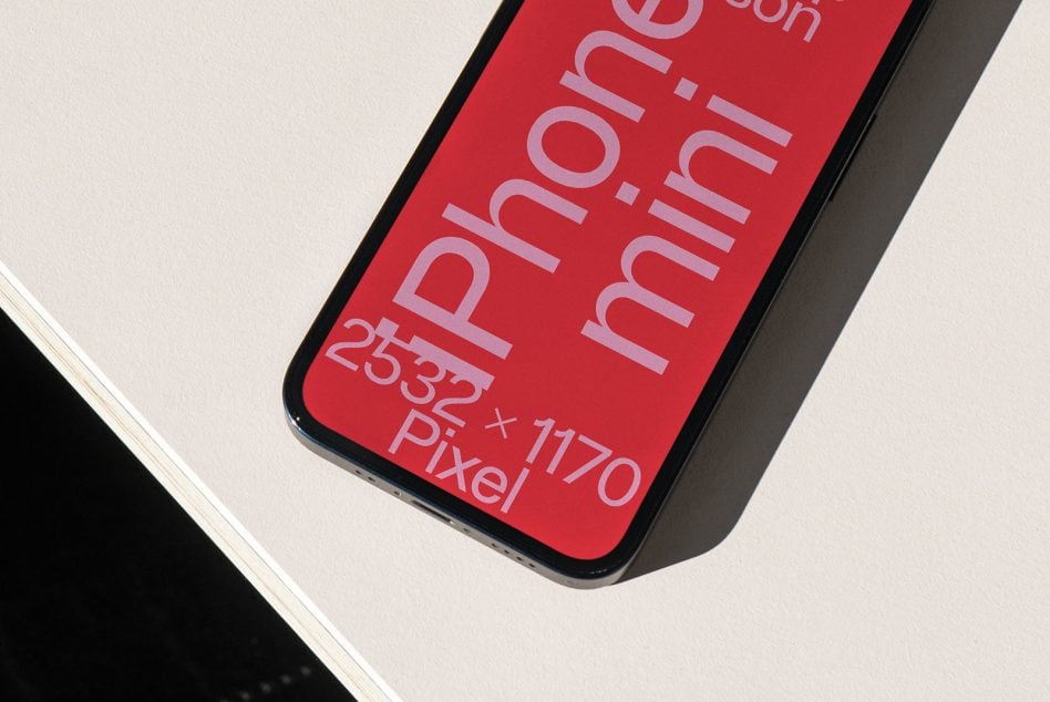 iPhone 12 Pro mockup with red screen on white surface dramatic shadow