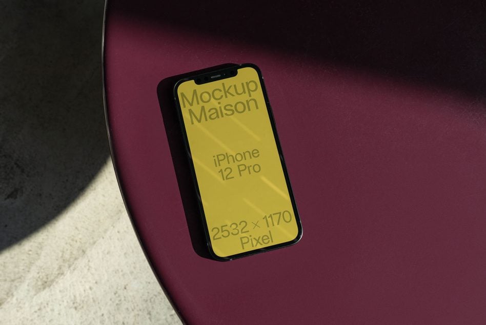 iPhone 12 Pro mockup with yellow screen on burgundy background with soft shadow