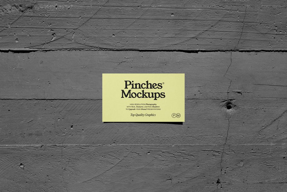 Yellow business card mockup on dark wooden surface