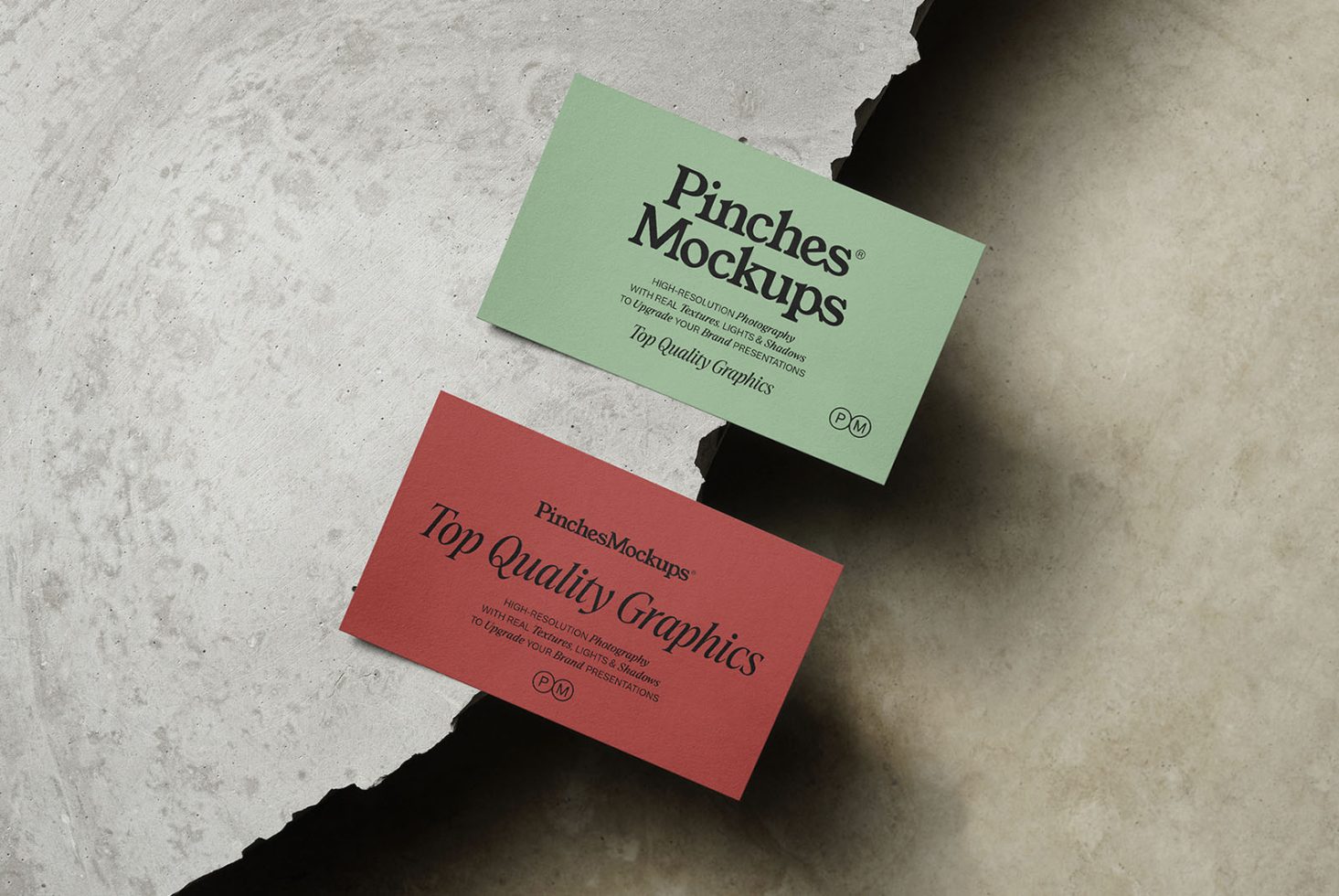 Two business card mockups on textured background, one teal and one red, displaying design and typography.