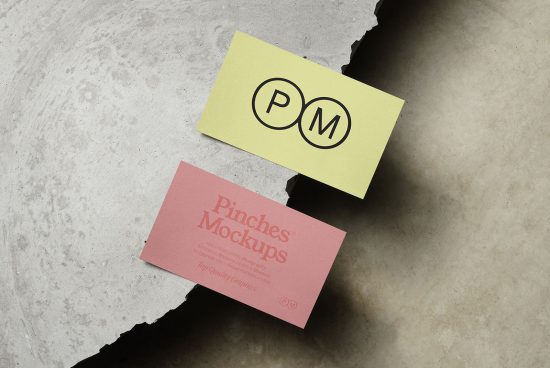 Two business card mockups on textured background, one pink and one yellow with sample branding, perfect for designers to showcase their work.