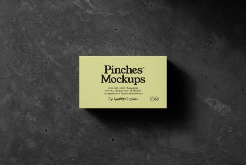 Business card mockup on a dark textured background featuring realistic shadows and a modern design, perfect for professional branding presentations.