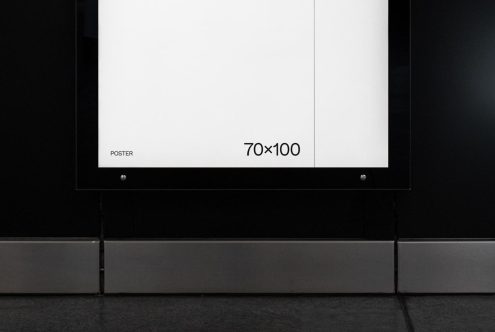 Blank poster mockup on indoor wall 70x100cm for advertising graphic design presentation or portfolio display.