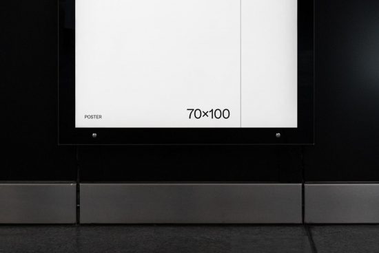 Blank poster mockup on indoor wall 70x100cm for advertising graphic design presentation or portfolio display.