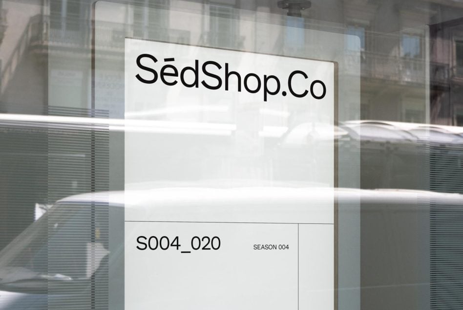 Glass storefront with frosted SedShop.Co signage, season 004 poster displayed