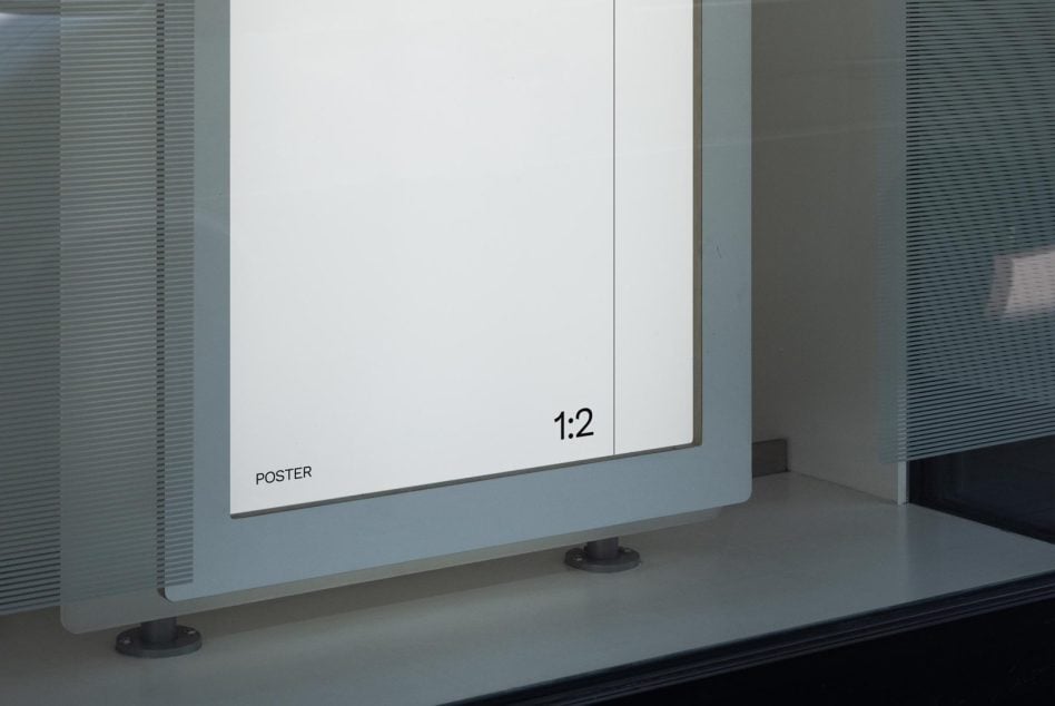White poster 1:2 ratio mockup displayed on glass frame