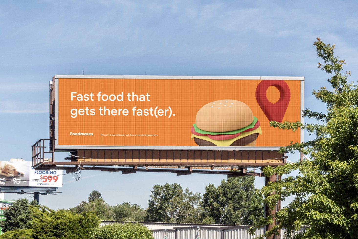 Outdoor billboard mockup with a fast food advertisement displaying a burger and map pin, ideal for graphic design projects, advertising concepts.