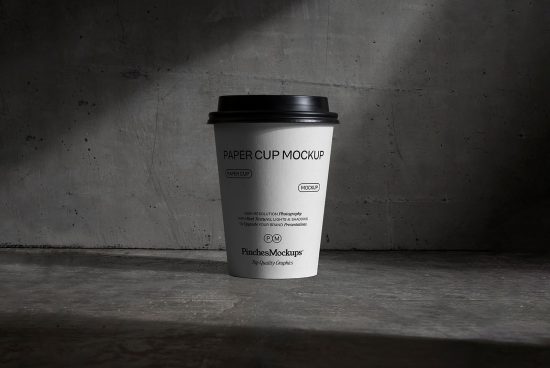 Realistic paper cup mockup on textured background for brand presentations and design mockups, ideal for graphic designers and portfolio showcases.