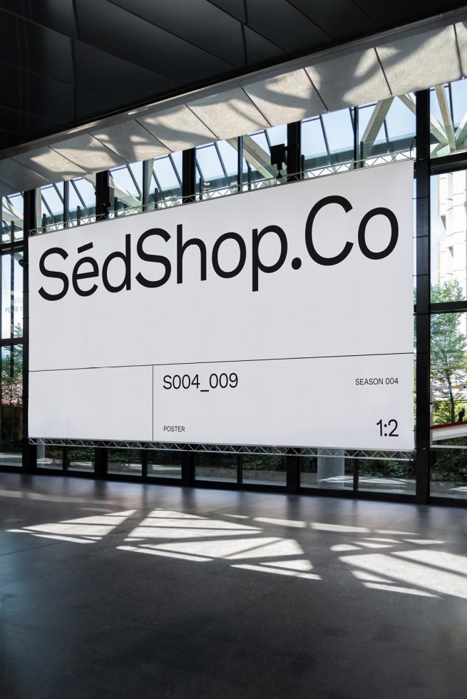 Large billboard mockup in a modern hall with natural lighting, ideal for advertising and graphic design presentations.