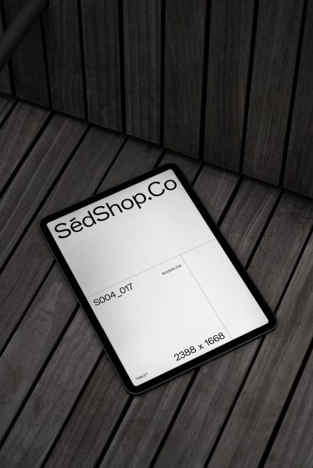 Digital tablet mockup on wooden floor for showcasing design work, ideal for designers digital assets portfolio display with high resolution display.