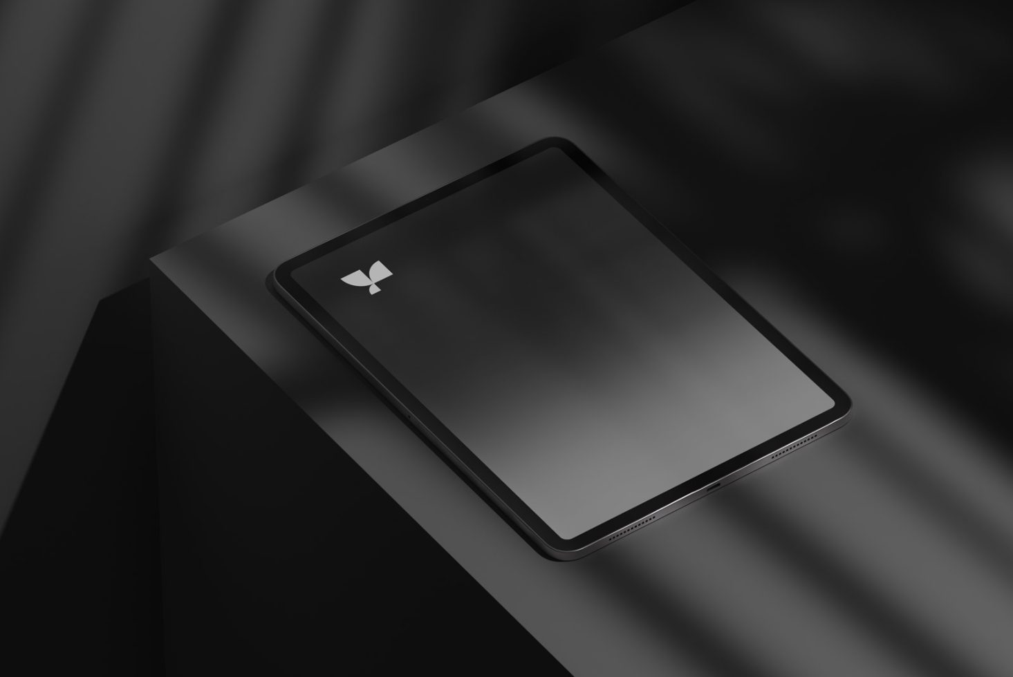 Elegant tablet mockup on a dark surface with shadows, modern design for showcasing apps and responsive websites for designers.