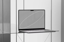 Sleek laptop mockup on reflective surface for presentation, ideal for showcasing UI/UX designs, templates for web and application developers.