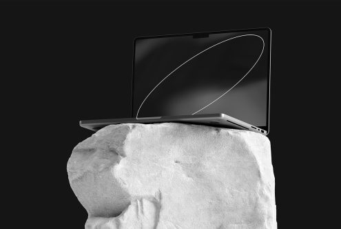 Modern laptop mockup on textured rock, showcasing sleek design and minimalist aesthetic, perfect for tech presentations and digital designs.