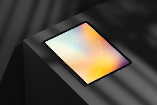Modern tablet mockup with colorful screen on dark striped background, digital device display template for graphic design presentation.