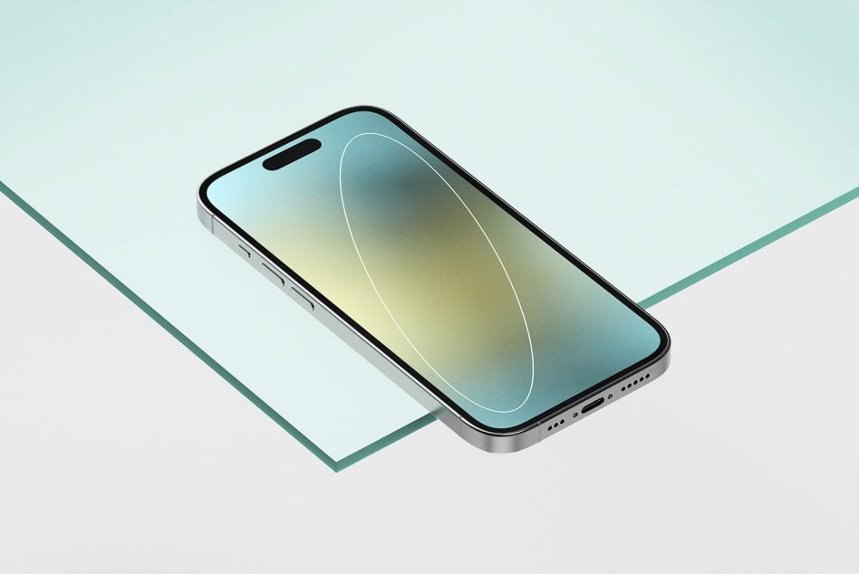 Phone mockup with blue-yellow gradient screen on mint green paper