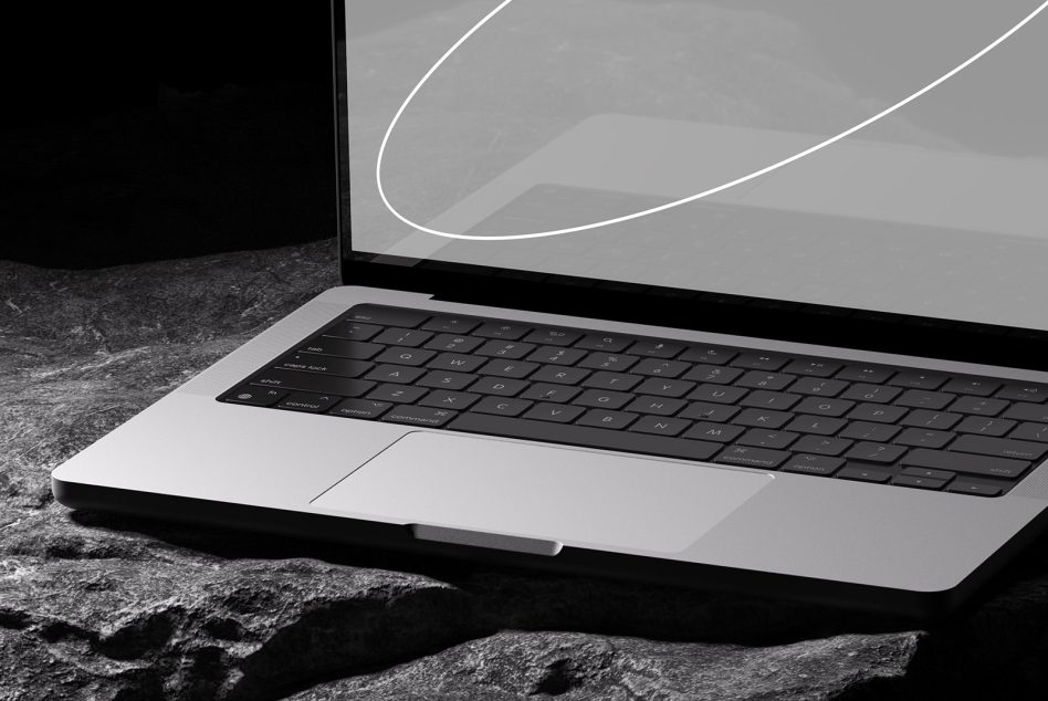 Laptop mockup on a stone surface with a sleek design ideal for presentations and tech-related design templates for professional designers.