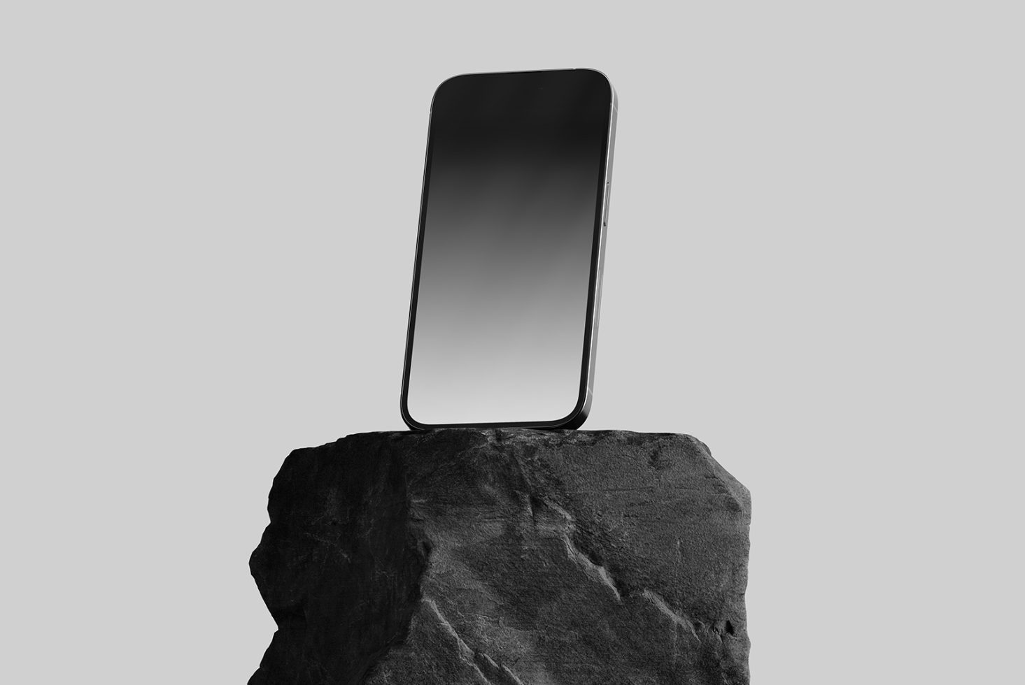 Minimalist smartphone mockup perched on a rock with a plain background, perfect for app design presentations and digital assets.