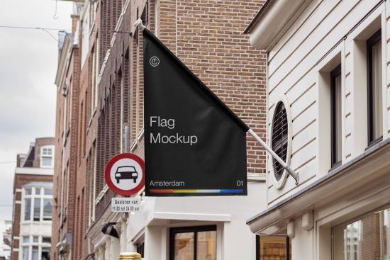Vertical flag mockup hanging on a building exterior in an urban street setting, realistic template design for presentations.