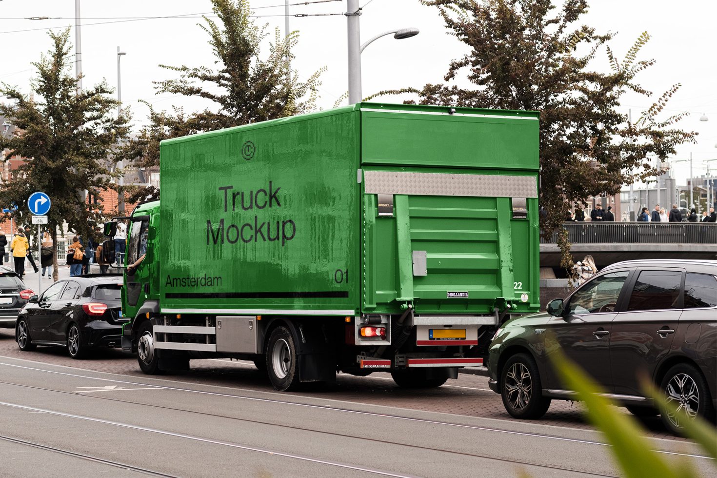 Green delivery truck mockup in urban setting perfect for showcasing branding and advertising designs, ideal for graphic designers.