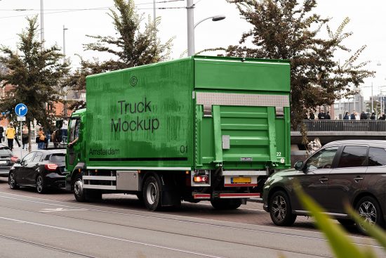 Green delivery truck mockup in urban setting perfect for showcasing branding and advertising designs, ideal for graphic designers.
