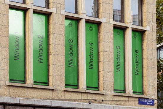 Facade with six green window mockup designs on a building, labeled Window 1 to Window 6, urban architecture, for template design showcase.