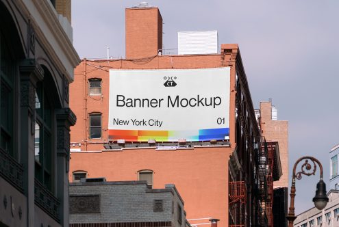 White banner mockup with rainbow stripe on NYC building rooftop