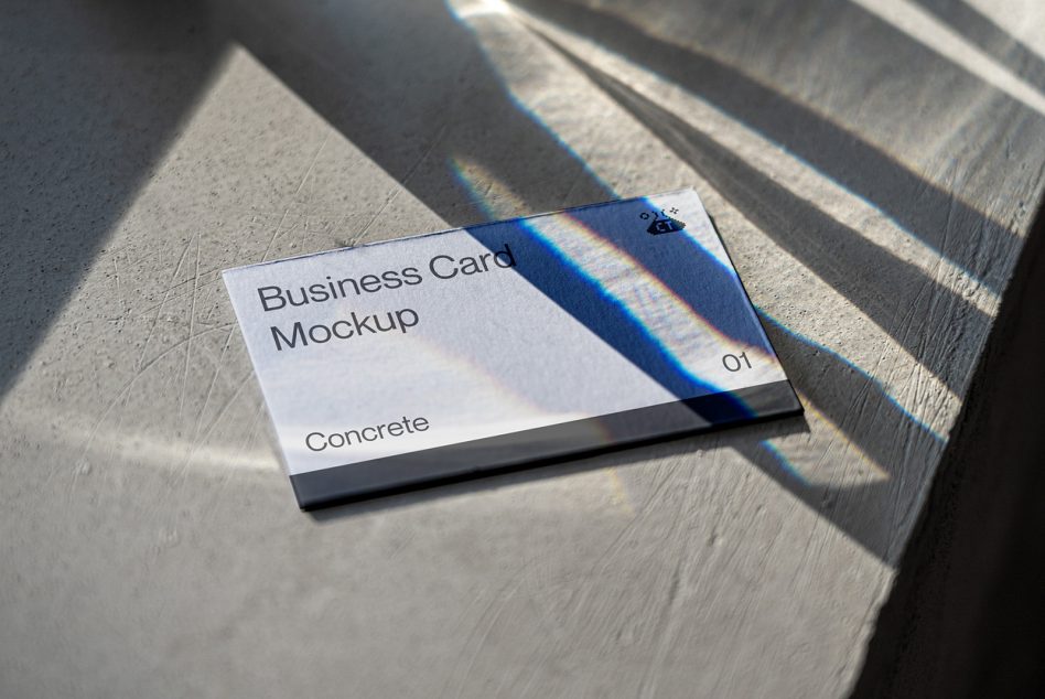 White business card mockup on wood with blue prism light casting shadows