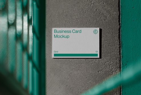Teal business card mockup on concrete with green wooden frame shadows