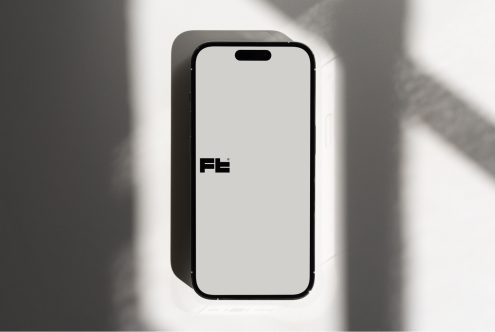 iPhone 14 Pro mockup in corner with soft diffused light creating geometric shadows
