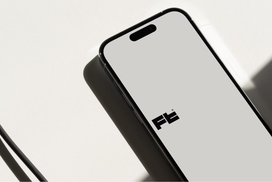 Phone mockup tilted at angle showing notch cutout against minimal backdrop