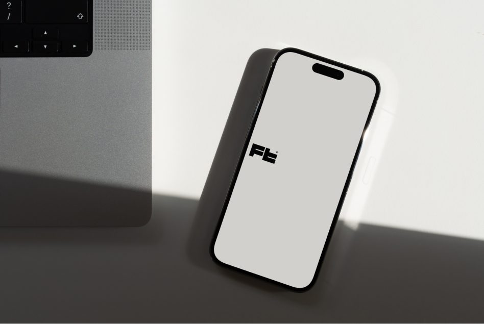 Smartphone mockup standing upright with blank white screen on neutral surface