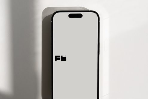 Vertical smartphone mockup against bright wall showing notch detail clearly