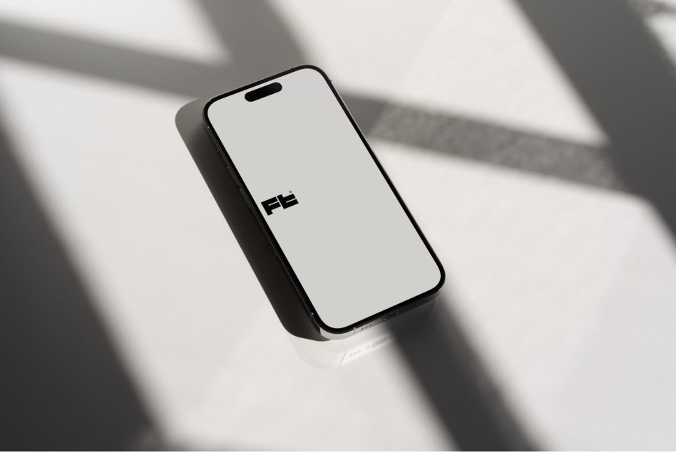 Overhead shot of black phone frame mockup with soft linear shadow patterns