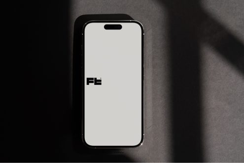 Modern black smartphone mockup with white display face straight on