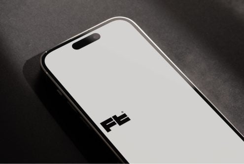 Modern smartphone mockup displaying minimalist logo on clean white screen