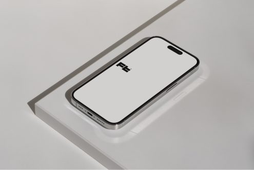iPhone 14 Pro mockup on white clay tray, side angle view, blank screen display