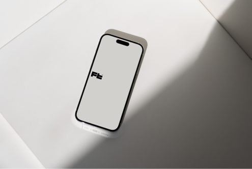 iPhone 14 Pro mockup centered overhead view with clean white screen on neutral background