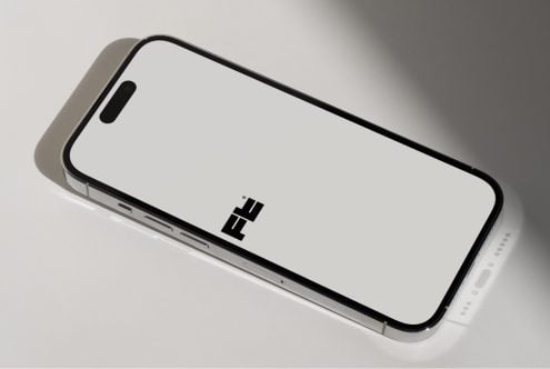 iPhone lying flat angled view with silver side visible mockup