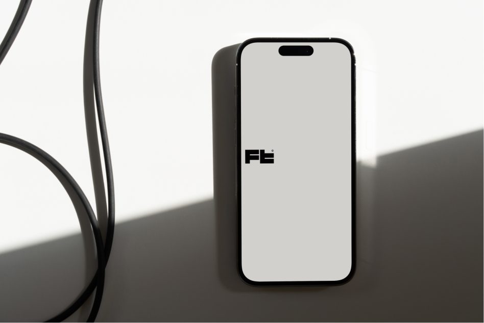Mobile device mockup next to curved plant stems on surfaces