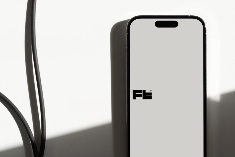 iPhone mockup with plant stems in frame, minimal setup