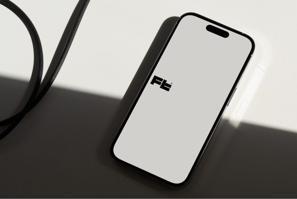 iPhone mockup with headphones on angled surface, shadow detail
