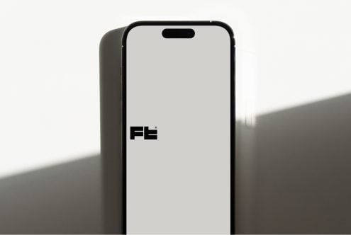 Black iPhone mockup with blank screen on white backdrop, side view
