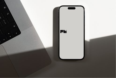 Modern phone mockup standing upright with soft workspace shadows