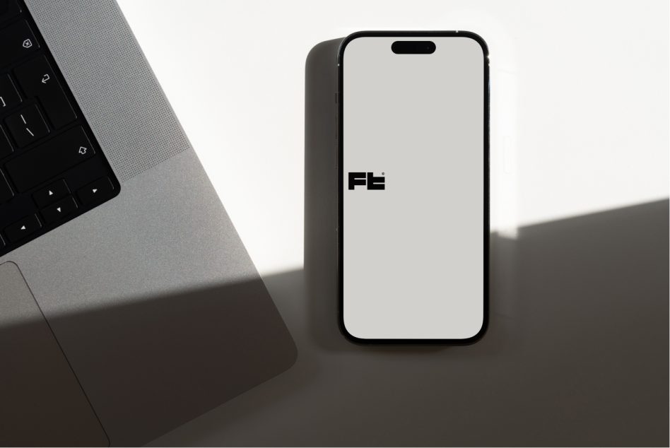 Modern phone mockup standing upright with soft workspace shadows